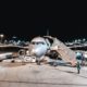 person standing near airliner