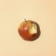 red apple fruit on white table