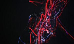 red and blue doodle artwork with black background