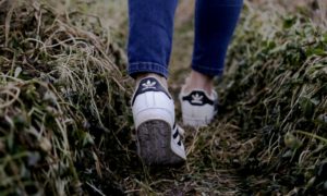 person walking on grass