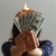 a fan of fake American dollars on fire
